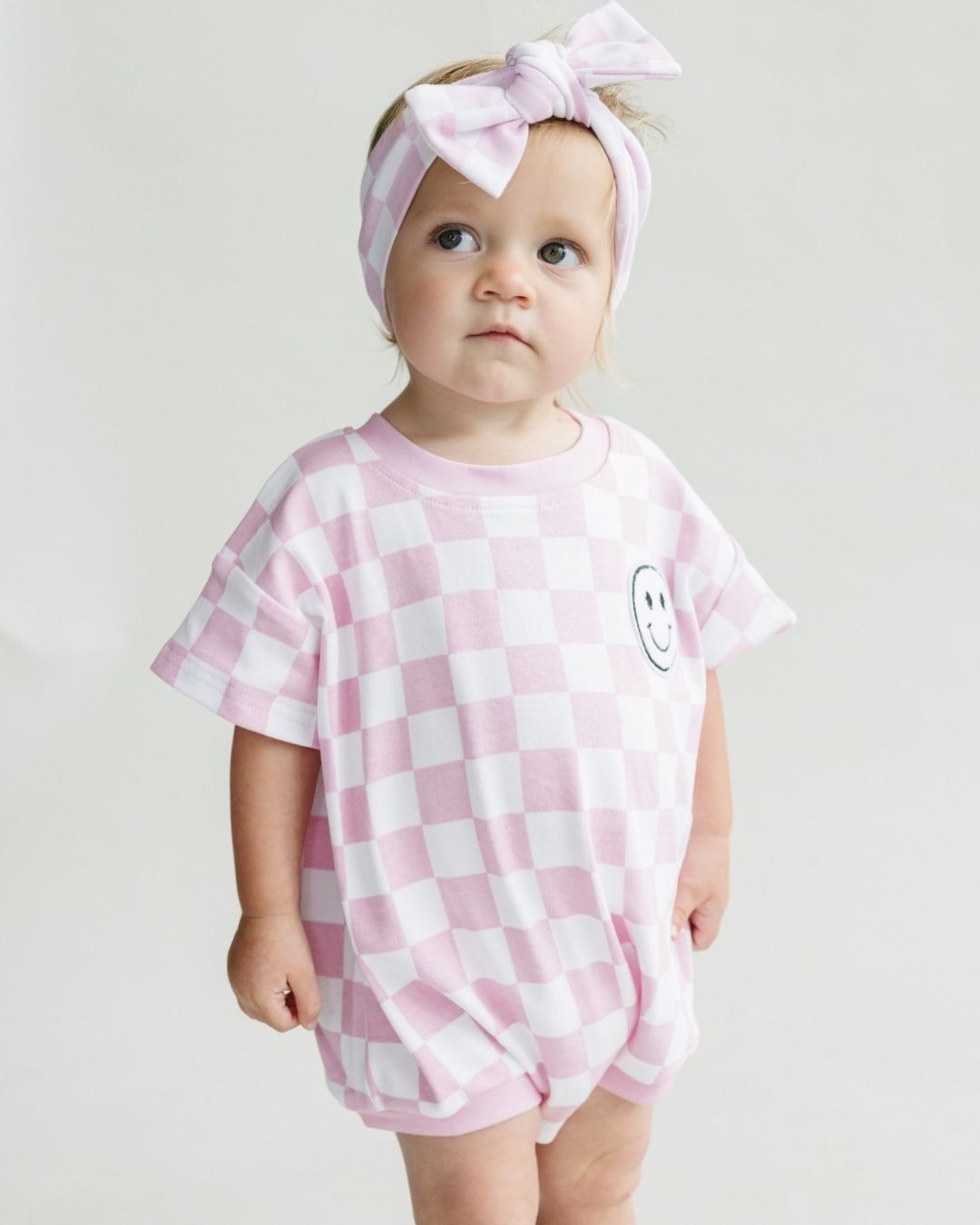 Short Sleeve Bubble Romper | Checkered Smiley Pink